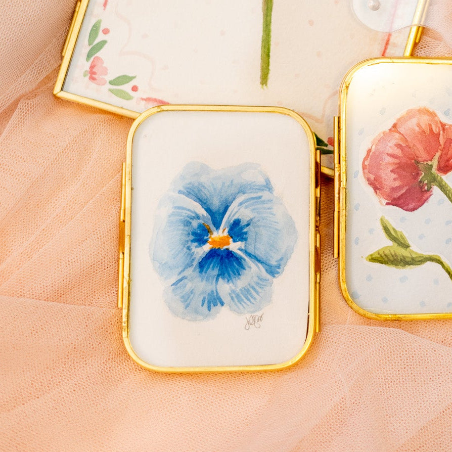 Small rectangular gold frame with a blue pansy flower painting 