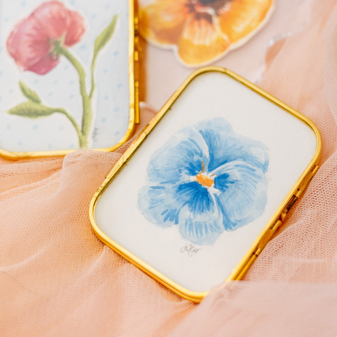 Small rectangular gold frame with a blue pansy flower painting 