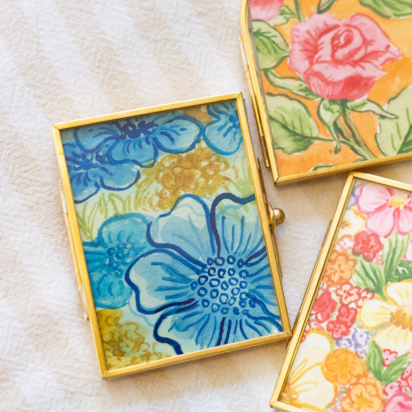 Decorative gold frames with floral paintings